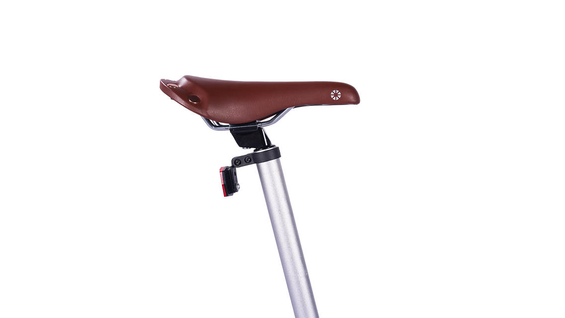 Boardwalk D7-20 inch folding bicycle brown leather seat with silver seat post and red reflector detail.