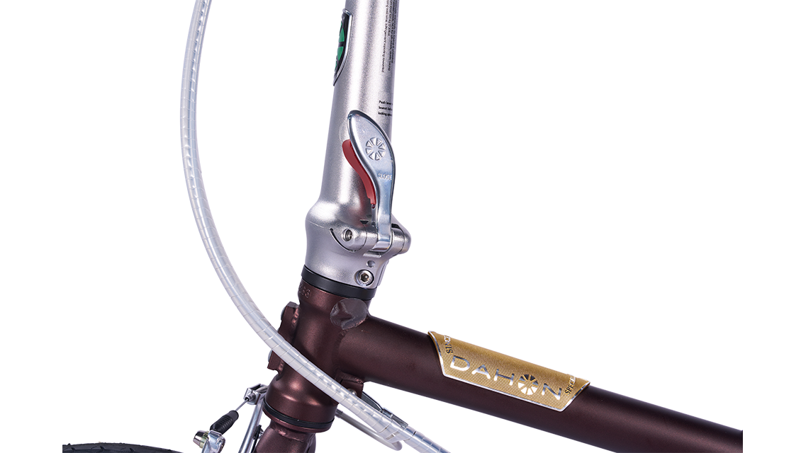 Boardwalk D7 bicycle frame with DAHON logo, metallic bronze finish, silver shifter with red accent.