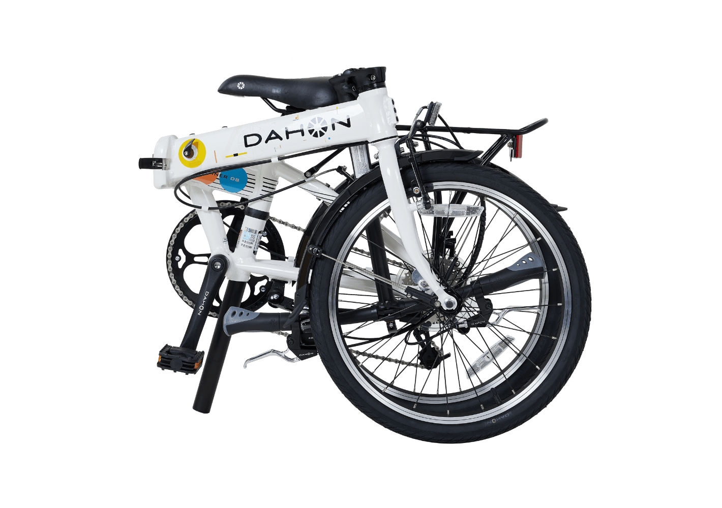 White DAHON Mariner D8 folding bike, partially folded, with Kenda tires, fenders, and rear rack on green background.